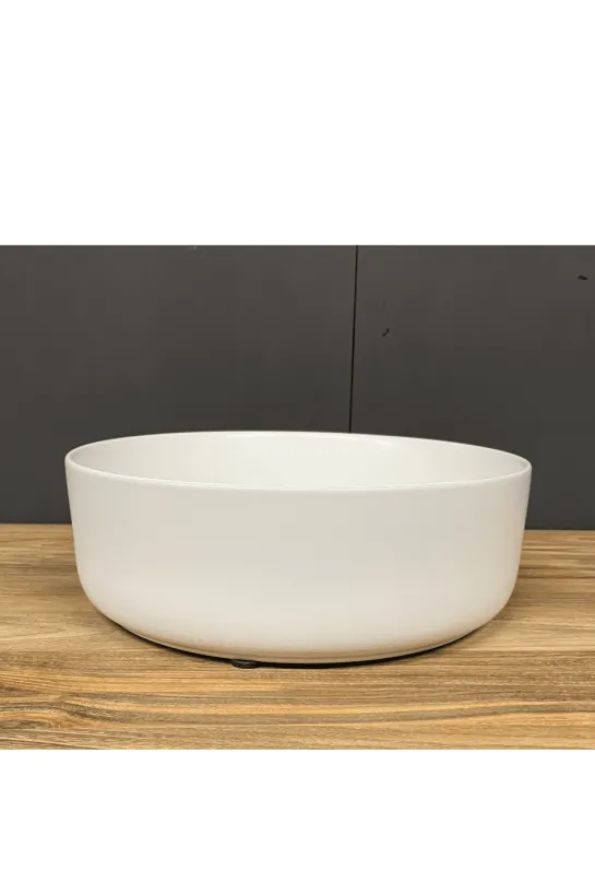 Witte ronde opbouw wasbak