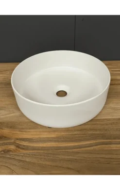 Witte ronde opbouw wasbak